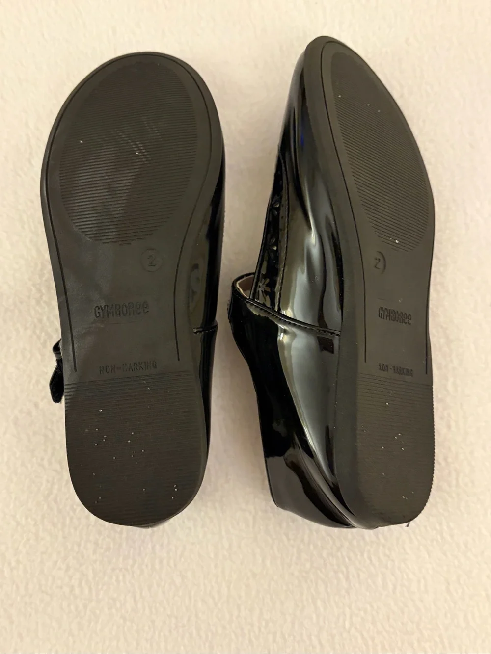 Black Patent Leather Style Eyelet Trimmed Maryjanes.